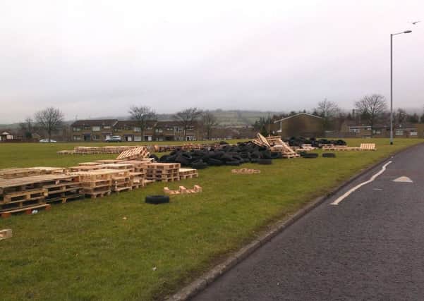 Hundreds of tyres and wooden pallets have been stacked up alongside Manse Way in New Mossley. INNT 07-504CON