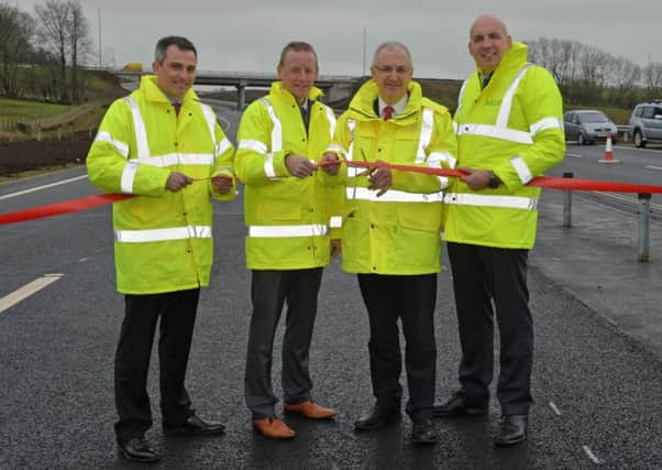 Danny Kennedy (2nd right) Minister for Regional Development cuts the ribbon to officially open the A8 Ballynure bypass with (from left) Cesar Sierra from Lagan Ferrovial, Colin Hutchinson from Transport NI and Chris Caves from ARUP. INNT 07-012-PSB