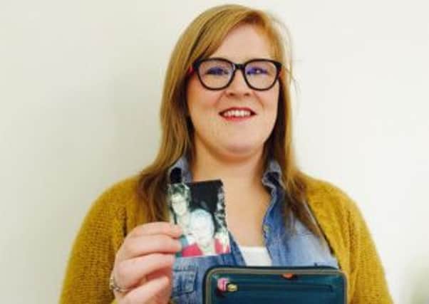 Aine Doyle with her purse and the picture of her granny that was inside