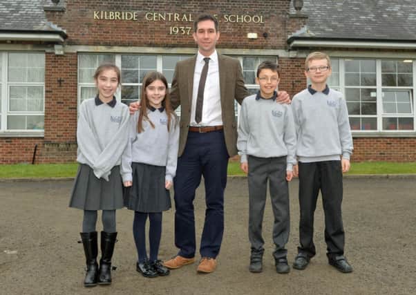 Kilbride Central Primary School principal Mr Chris Currie with P7 pupils Ellie, Abbey, Zak and Andrew. INNT 07-017-PSB