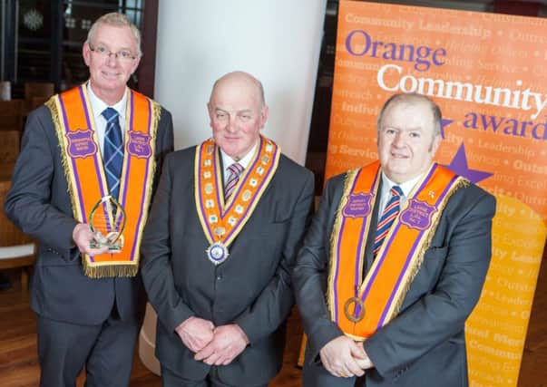 Representatives from Larne District LOL No 1 were recognised for organising a hugely successful flagship Twelfth demonstration last year at the annual Orange Community Awards. (L-R) Harry Carter, District Master; Edward Stevenson, Grand Master of the Grand Orange Lodge of Ireland; and David Swann, Deputy District Master.  INLT 07-686-CON