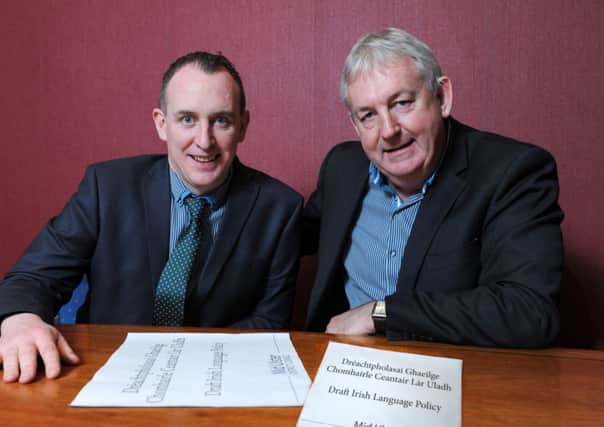 Pictured with the draft Irish Language Policy for Mid Ulster District Council are Councillor Cáthal Mallaghan, Presiding Councillor (Chair) and Councillor Sean McPeake, Chair of the Councils Policy & Resources Committee.