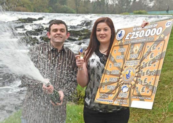 Champagne moment: Claire Marks and her husband, Clifford celebrate their £250,000 scratchcard win. Pic by Simon Graham