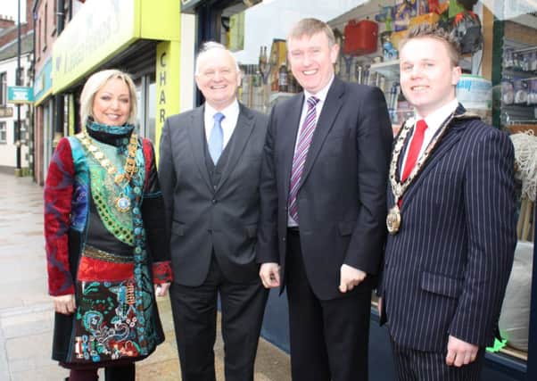 Social Development Minister Mervyn Storey MLA (second from right) is welcomed to Ballyclare by Mayor Thomas Hogg, South Antrim MP William McCrea and President of Ballyclare Chamber of Trade, Alison Thompson. INNT 08-502CON