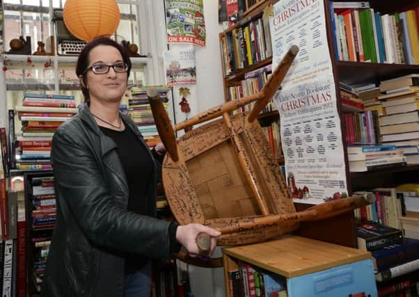 Little Acorns Bookstore owner Jenni Doherty pictured with one of the chairs. INLS0715-106KM