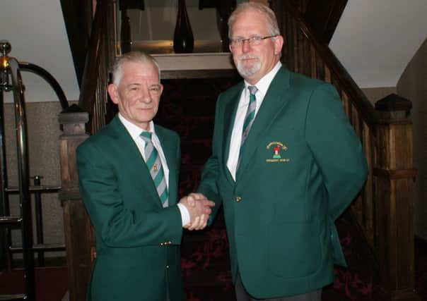 Pictured is the incoming 2015 Redcastle Captain Mr W Watson (left) being welcomed by Redcastle President Mr Desy Carton