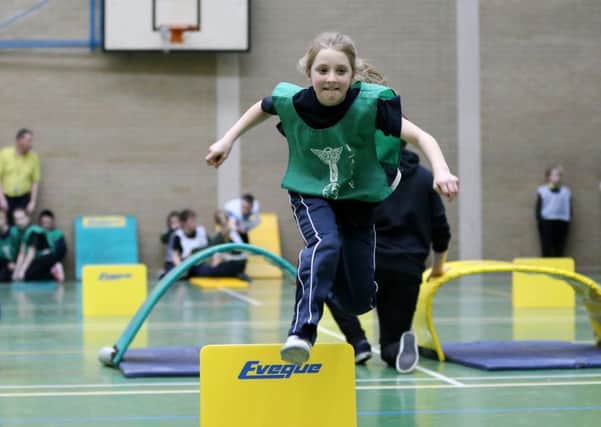 Matilda McClelland of Moorfields PS clears the final hurdle during her race in the Primary Schools Indoor Athletics Championships at NRC Farm Lodge Campus. INBT 07-174CS