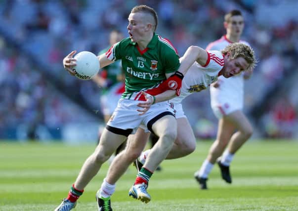 Darragh Doherty of Mayo with Frank Burns of Tyrone ©INPHO/Donall Farmer