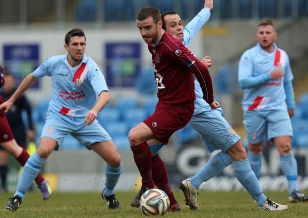 Ballymena United's Tony Kane attempts to challenge Institute's Aaron Walsh during today's Danse Bank Premiership match at the Showgrounds. Picture: Press Eye.