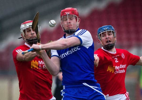 Monaghan's Fergal O'Dowd pulls off a shot as Tyrone's Tiernan Morgan and Conor McNally approach. INTT0815-700DCA