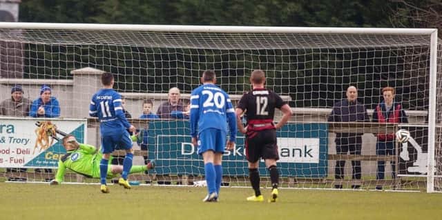 Jason McCartney's penalty hits the net to give Ballinamallard the win six minutes into added time. photo: Derek Simpson