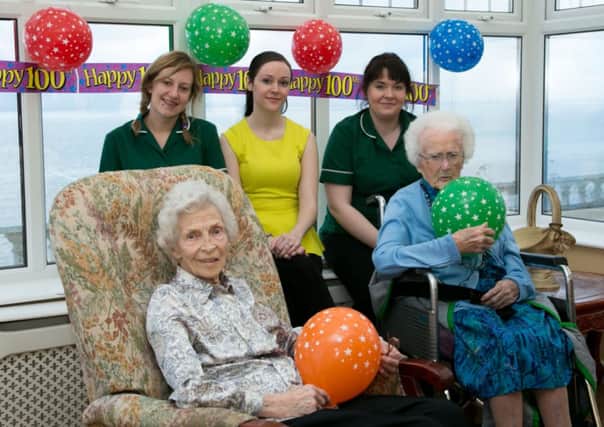 Celebrating their 100th birthday at Ravenhill Nursing Home are Alice Scott, who hits the milestone on February 27, and Lizzie Hamill, who celebrated her birthday on February 16.  Also pictured are staff members Hayley Craig, Lynsey Browne and Rachel McWilliams. INCT 07-402-RM