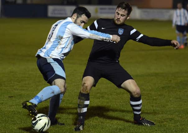 Claudy Rovers defender Connor Johnstone tussles with Ardmore's Damien McGee, during Friday night's League Cup Final.
