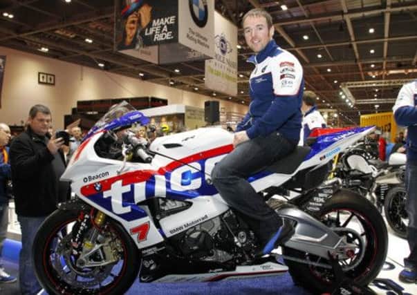 Alastair Seeley tries out the Tyco BMW for size. INLT 08-913-CON