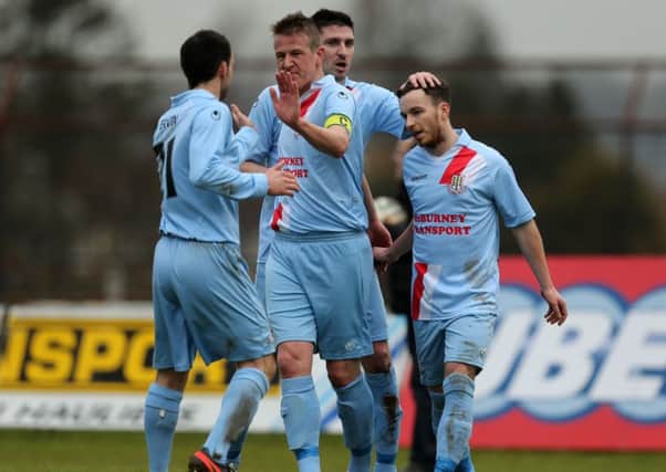 Ballymena United captain Allan Jenkins is congratulated by team mates after scoring his team's second goal against Institute. Picture: Press Eye.