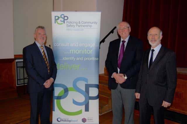 Justice Minister David Ford pictured at the Coleraine PCSP public meeting, with Gary Mullan, PCSP Manager and councillor David Barbour, PCSP Chair.