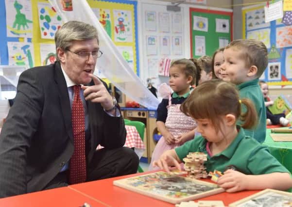 Education Minister John O'Dowd during a visit to Holy Trinity Primary School last month.