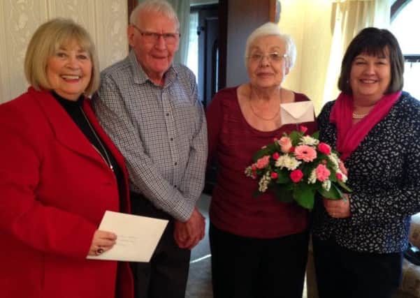 Ron and Audrey Maddison, who have celebarted their 60th wedding anniversary, are pictured with Anne Chin, President and Shirley Sinclair, Secretary of Islandmagee North WI.  INLT 08-675-CON