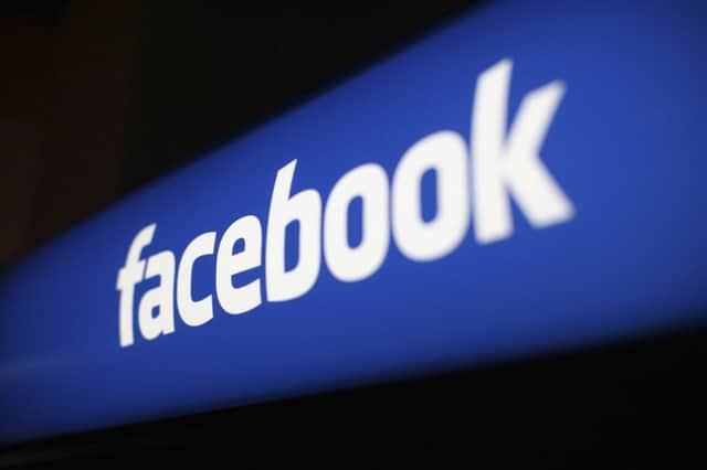The Facebook logo is pictured at the Facebook headquarters in Menlo Park, California, in this January 29, 2013 file photo. Facebook Inc advertising business grew at its fastest clip since before the company's May initial public offering, helping the company's revenue expand 40 percent to $1.585 billion. REUTERS/Robert Galbraith/Files   (UNITED STATES - Tags: BUSINESS LOGO)