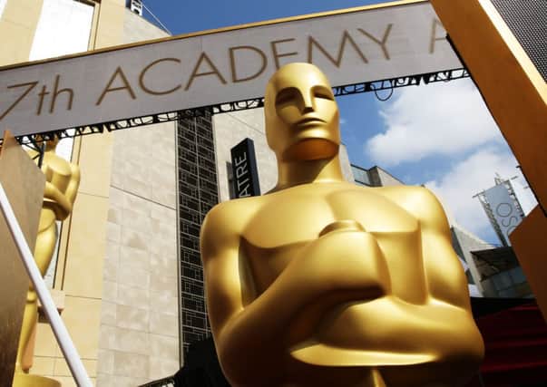 An Oscar statue is seen as preparations are made for the 87th Academy Awards in Los Angeles