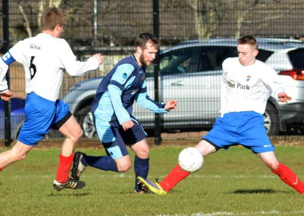 Whitehead Eagles Chris McMillen weaves his way through the Grange Rangers defence. INNT 08-121-GR