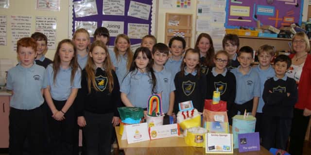Primary 6 worked in groups to think of Recipes for Friendship and have made a range of cakes representing their ingredients and methods pictured with Mrs McConnell school principal