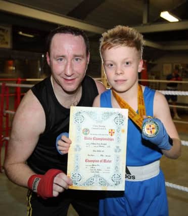 Martin Laverty, head coach at Lisburn Boxing Club, with club member Thomas Orr who won the Ulster title at the recent championships.