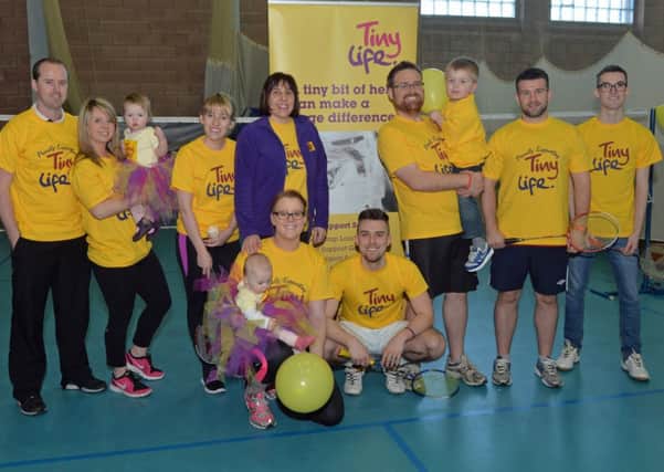 Barry Clements (front) is pictured with his wife, Rachael and daughter, Phoebe along with family and friends including Gillian Breen fundraising manager with Tiny Life. Barry completed a 9 hour "Badminthon" to raise funds for Tiny Life as his daughter, Phoebe and nephew, Ruben were born prematurely. INLT 07-025-PSB