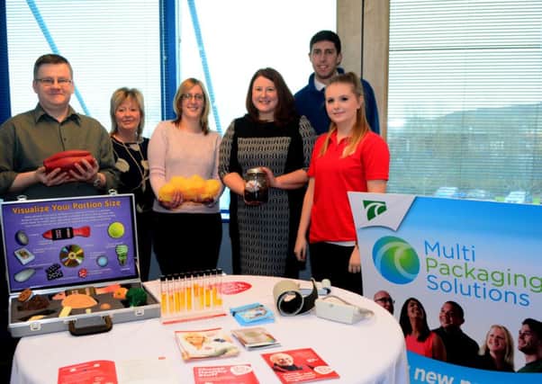 Ronan Devlin, Sally Jess, Christine Simms, Elaine McNeill and James Morrow from Multi Multi Packaging Solutions with Gemma Fairfield, the Health promotion services provider at NI Chest Heart and Stroke, the chosen charity of Multi Packaging Solutions. INNT 08-102-GR