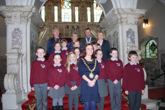 Sean McKinley(President Ballycastle Rotary Club), Diana Evans (Secretary and Rotakids Co-ordinator) William Cross (Rotary Assistant -Governor) and Grainne Bagnell (Rotary Youth Services Chair) along with 12 founding members of Rotakids and Belfast Lord Mayor Nichola Mallon on the stairs of City Hall. INBM09-15