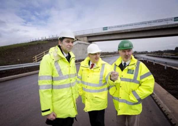 Pictured with Transport Minister Danny Kennedy during a site visit are Basil Hassard, Transport NI project Manager and Stephen McFaul, project manager. Picture by Brian Morrison