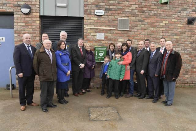 Pictured at the unveiling of the 24/7 public access defibrillator on the Ivan Davis Pavilion in Wallace Park are members of Lisburn City Council, Sheila Osborne and her family, who donated the defibrillator; Art Kernan, Defib4kiz; Paul Givan MLA and Ivan Davis.