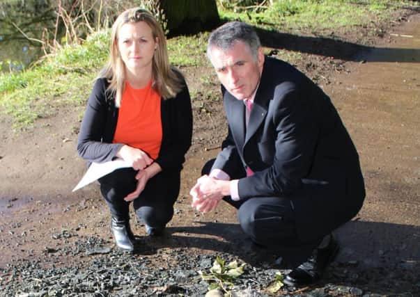 Councillor Anne Marie Logue and Declan Kearney surveying some of the damage in Crumlin Glen