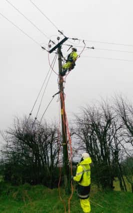 Undated handout photo issued by Northern Ireland Electricity of NIE emergency crews repairing the electricity network near Ballyclare, as some 5,000 homes and businesses are without power after severe gales battered parts of Northern Ireland. PRESS ASSOCIATION Photo. Issue date: Thursday January 15, 2015. Gusts of around 70 miles-an-hour and flying debris ripped down power lines, electricity poles and trees, leaving some roads impassable. See PA story WEATHER Winter Ulster. Photo credit should read: Northern Ireland Electricity/PA Wire

NOTE TO EDITORS: This handout photo may only be used in for editorial reporting purposes for the contemporaneous illustration of events, things or the people in the image or facts mentioned in the caption. Reuse of the picture may require further permission from the copyright holder.