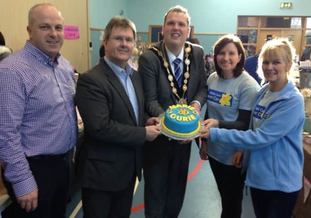 Alderman James Tinsley, Jeffrey Donaldson mp, the mayor Cllr Andrew Ewing ,Cllr Yvonne Craig and Amanda Scott community fundraiser Marie Curie with a Marie curie cake which was baked for the craft fair