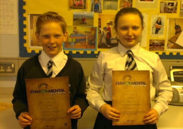 Victoria Primary School pupils Harry Norton and Lauren Swann with their cerificates form the Environmental Youth Speak competition.  INCT 09-721-CON