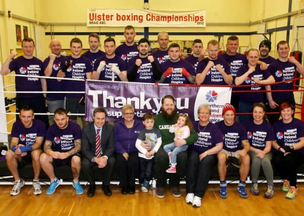 Boxers who are participating in the forthcoming "White Collar Boxing" night to be held on March 6 raising money for the Northern Ireland Children's Hospice. Included are George Courtney (organiser), Paul Frew MLA, Catherine O'Hara (NI Childrens Hospice), Helen Knox (NI Children Hospice) and Paul Jenkins and his daughter Eva and son Eli. INBT09-231AC