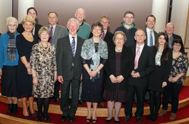 TAKING PART. Rev Hugh Mullan and his wife Deirdre, pictured with Musicians, Speakers and those who helped organise a special night on Saturday night to mark the Minister's retirement. Included are Clerk of Session, John Walker and former Moderator Rev John Dixon.INBM9-15 033SC.