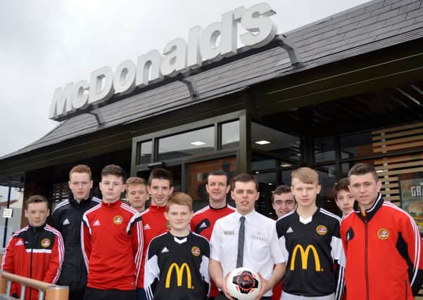 Carniny Youth Under 15s who were nominated the club Team of the Month receiving their complementary lunches from Stuart Hunter (Assistant Manager) from kit sponsors McDonald's Ballymena