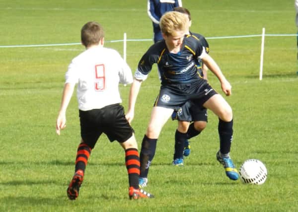 Cookstown Youth Under 14 player Shane Murphy in action against Larne FC at MUSA last weekend.