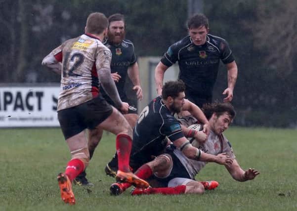 Ballymena's Matty Rice tackles Malone's Thomas Burns during Saturday's game at Gibson Park. Picture: Press Eye.