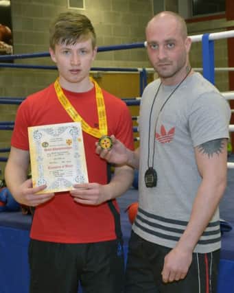 Banbridge boxer Sean Casey, crowned Boys 14 years Ulster Champion at the finals in Eglinton Community Centre, with Coach Eoin Gribben ©Edward Byrne Photography INBL1509-200EB