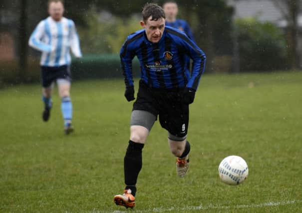BBOB's Grant Garden sets off on an attacking run during their match against Claudy Rovers. INLS0915-133KM