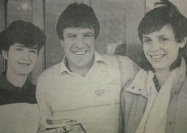 Former Liverpool FC player Emlyn Hughes with Julie Harte and Carolyn Maghie during his visit to Carrickfergus in 1986. INCT 09-708-CON