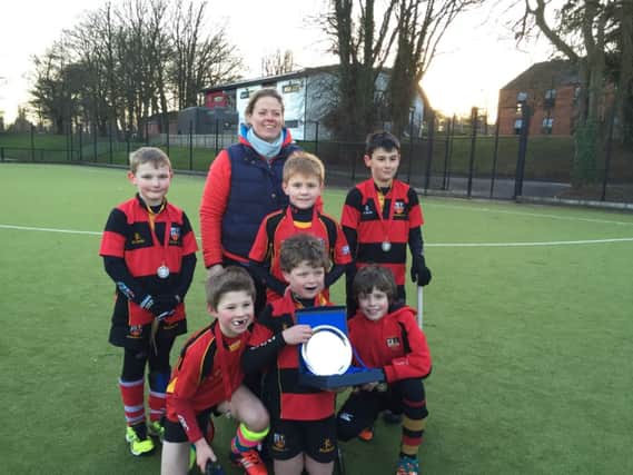 The Banbridge U11 Boys B team who were runners up in the Plate competition along with coach Suzanne Evans.