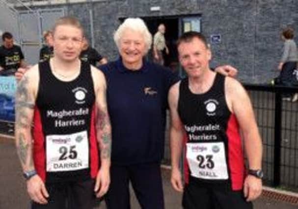 Dame Mary Peters, pictured here with Magherafelt Harriers Darren Church and Niall Higgins. Dame Mary will start the Magherafelt Harriers 10k Classic Road Race on March 14th