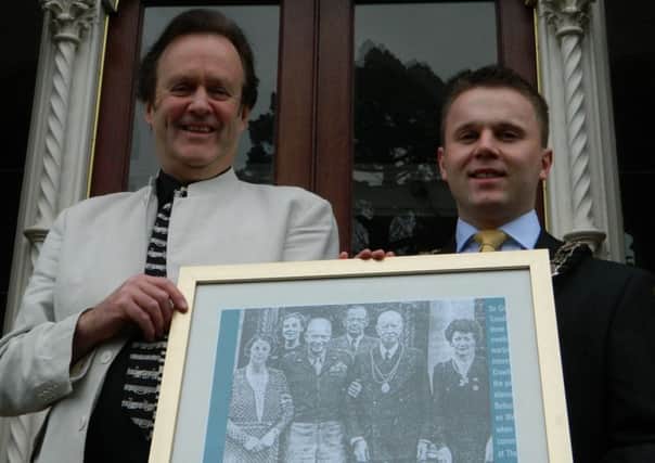 Newtownabbey mayor Alderman Thomas Hogg (right) with Tim Clifford outside Abbeydene B&B with a picture of Dwight D Eisenhower visiting Sir Crawford McCullough at the same house in 1945. INNT 09-452-CON