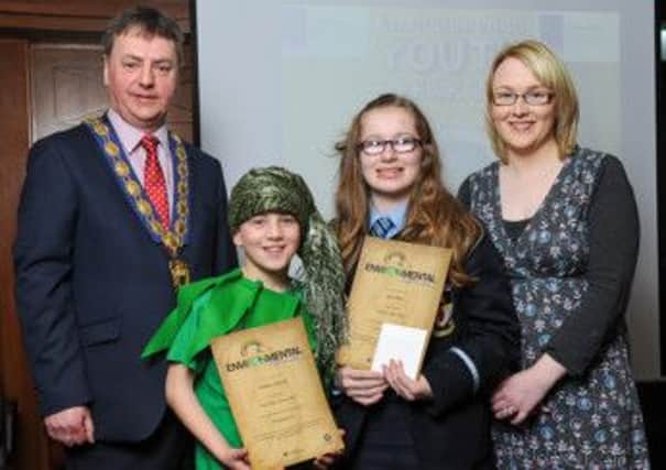 Council chair Wilbert Buchanan and re-cycling officer Karen Brown with winners of Cookstown Council Environmental Youth Speak competition, Matthew McCann (Holy Trinity PS) and Joyce Allen (Cookstown HS)
