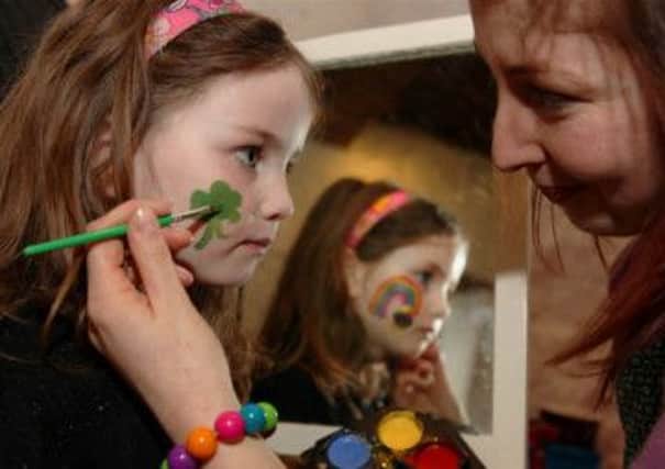 Niamh Haughey has her face painted at Springhill's St Patrick's weekend