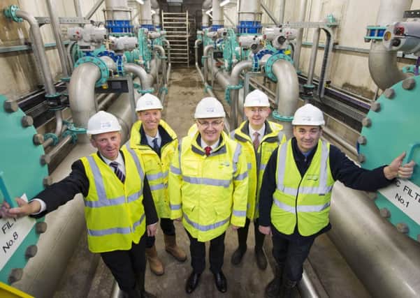 NI Water staff Maynard Cousley, Bob McGarvey, Paul Davison and Francis Bradley, pictured with the Regional Development Minister Danny Kennedy on site at Dorisland Water Treatment Works.  INCT 09-740-CON